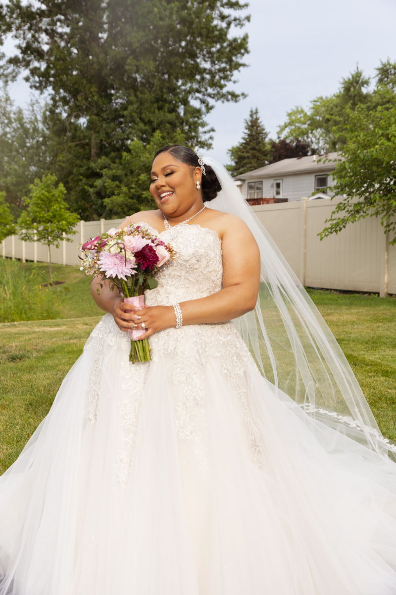 Flawlessly Gorgeous: Highlighting the Beauty of Curvy Brides in Wedding Dresses Image