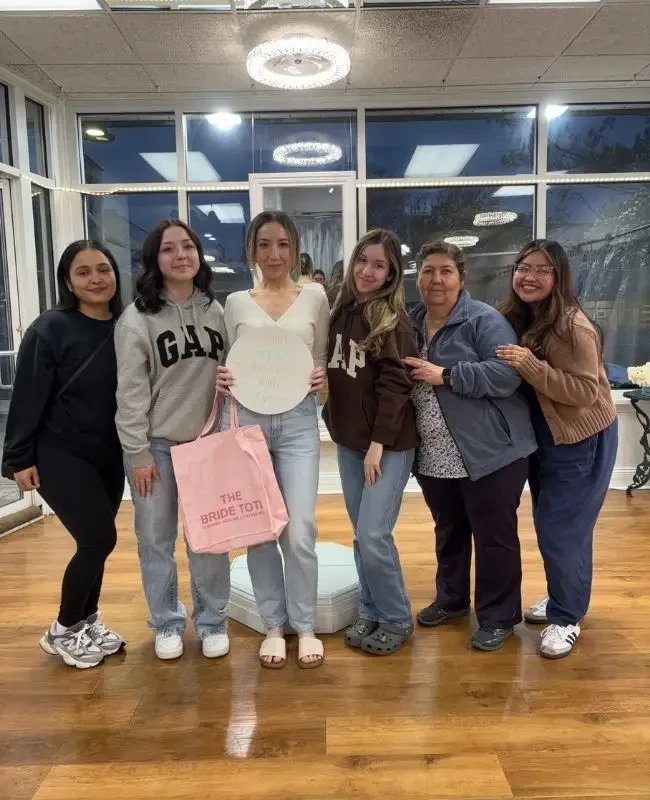 Bride holding her Bride Tote from Elegance Wedding and Evening Wear