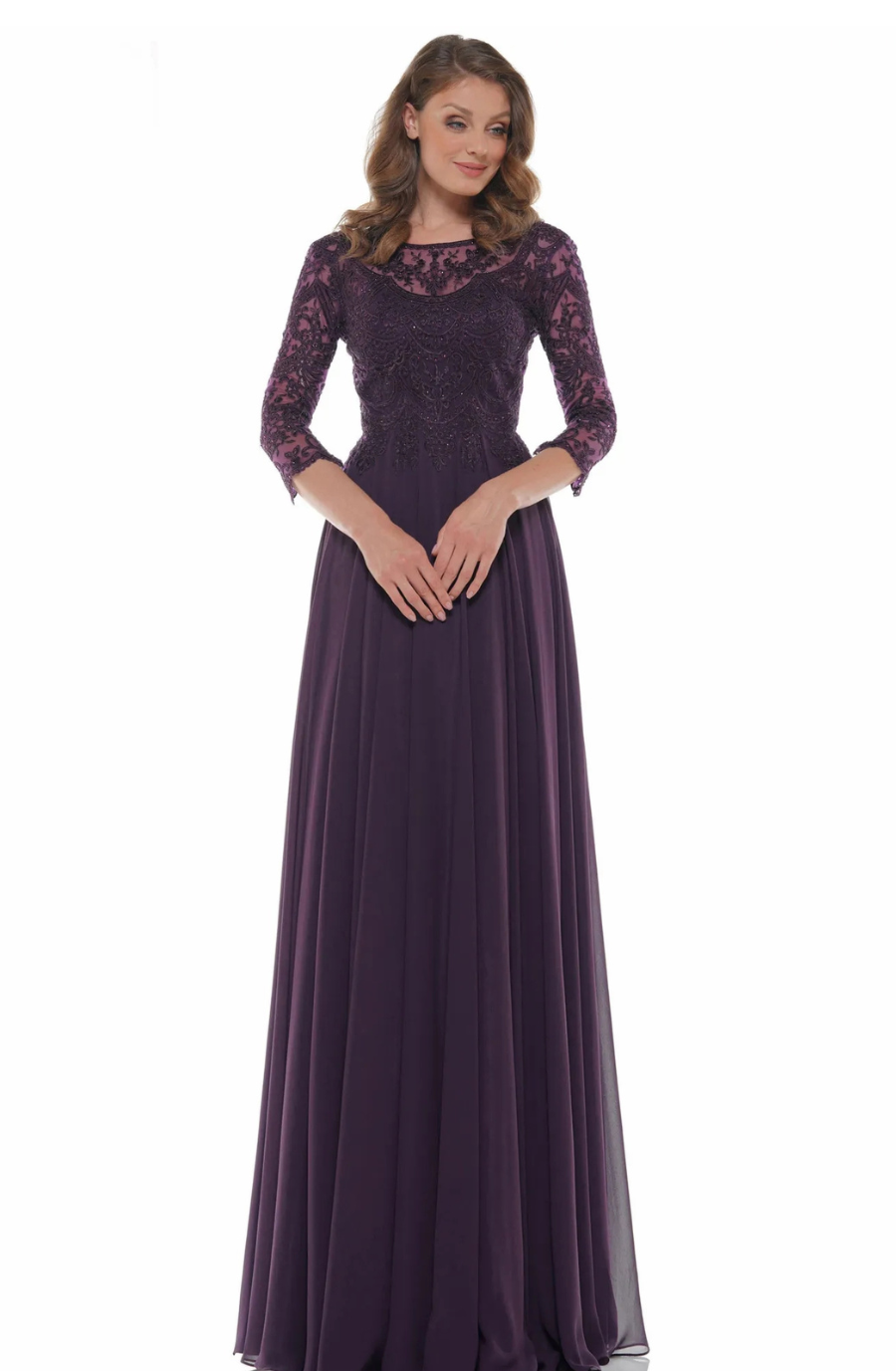 model is wearing an eggplant evening gown with three quarter sleeves