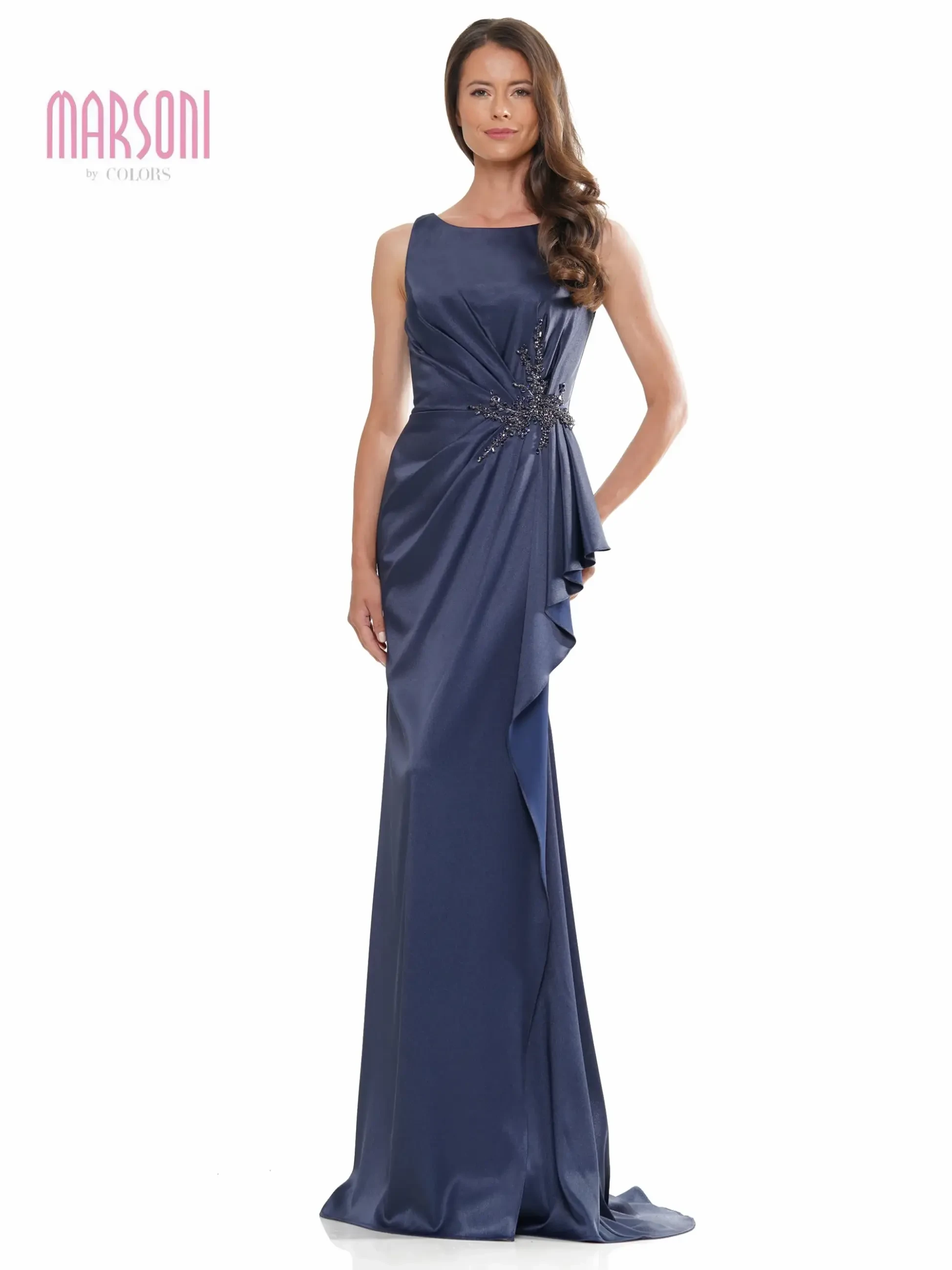 model is wearing a sleeveless fitted evening gown with embellishments on the hip