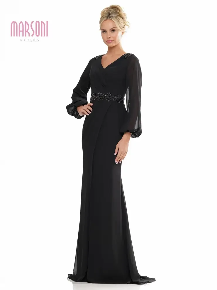 model is wearing a black long sleeve evening gown