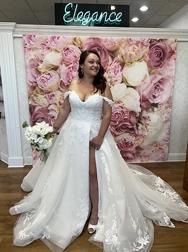 Bride in front of a sign for elegance wedding bridal shop in highland indiana