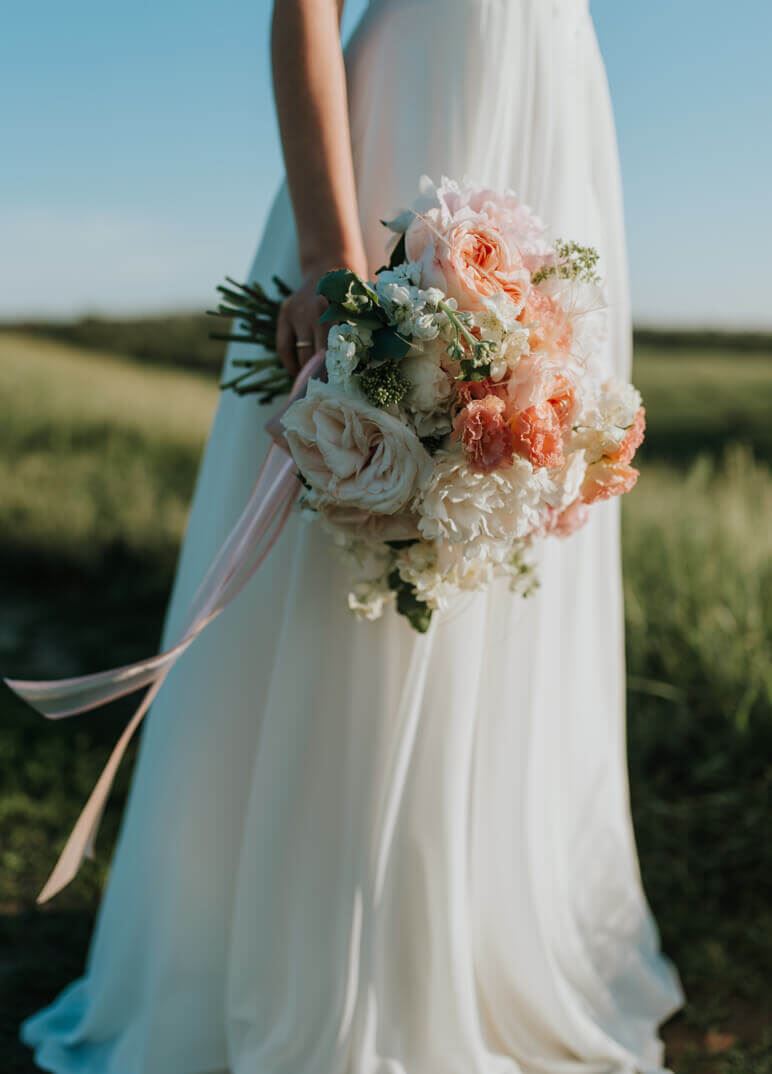 Model holding bouquet of flowers
