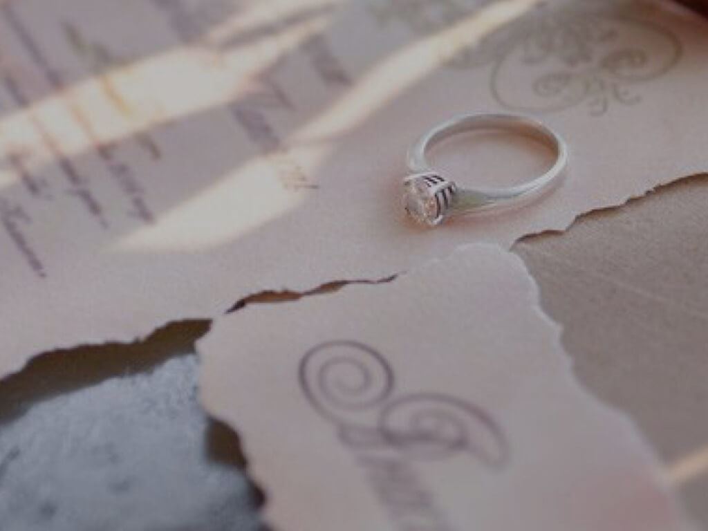 Close up image of wedding invitations shown on mobile device