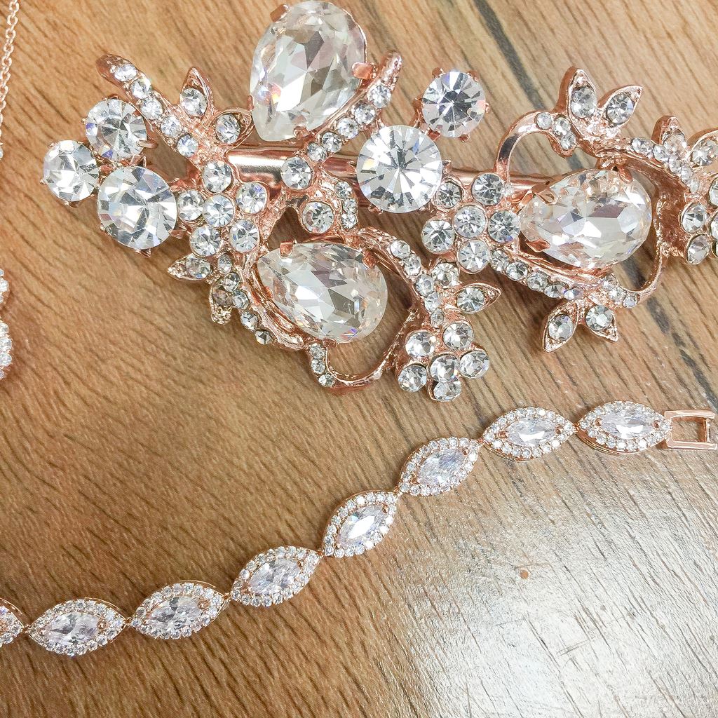 Close up image of rose gold hair piece and rose gold belt